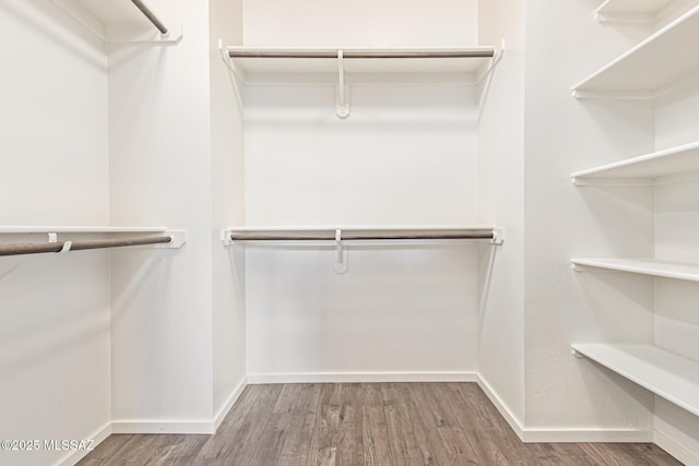 890 E Millenium Ct Unit E, Tucson, AZ 85719 - spacious closet featuring wood finished floors