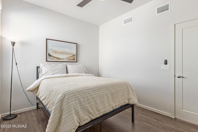 890 E Millenium Ct Unit E, Tucson, AZ 85719 - bedroom featuring wood finished floors, baseboards, and a ceiling fan