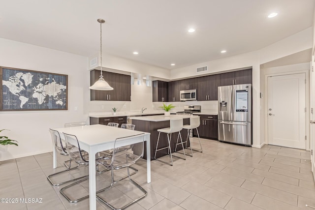 890 E Millenium Ct Unit E, Tucson, AZ 85719 - dining room with light tile patterned flooring, recessed lighting, and baseboards