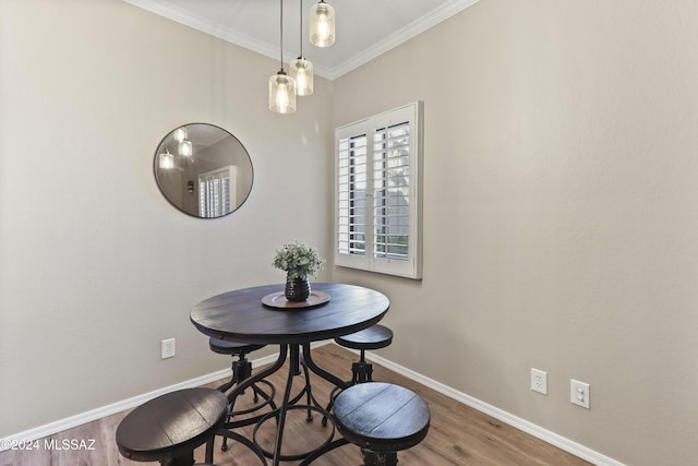 5500 N Valley View Rd Unit 211, Tucson, AZ 85718 - dining room featuring baseboards, wood finished floors, and ornamental molding