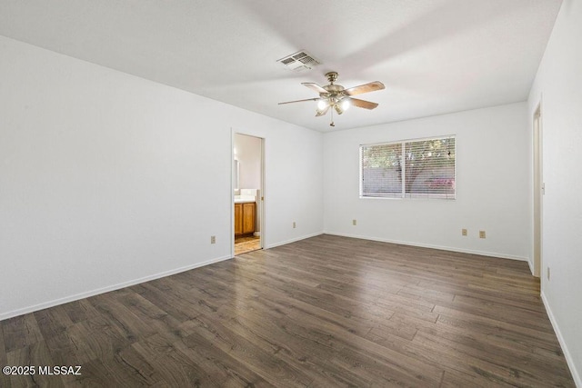 7925 S Danforth Ave, Tucson, AZ 85747 - empty room with ceiling fan, dark wood finished floors, and baseboards