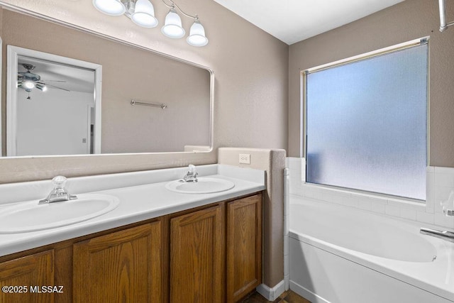 7925 S Danforth Ave, Tucson, AZ 85747 - bathroom with double vanity, a bath, and ceiling fan