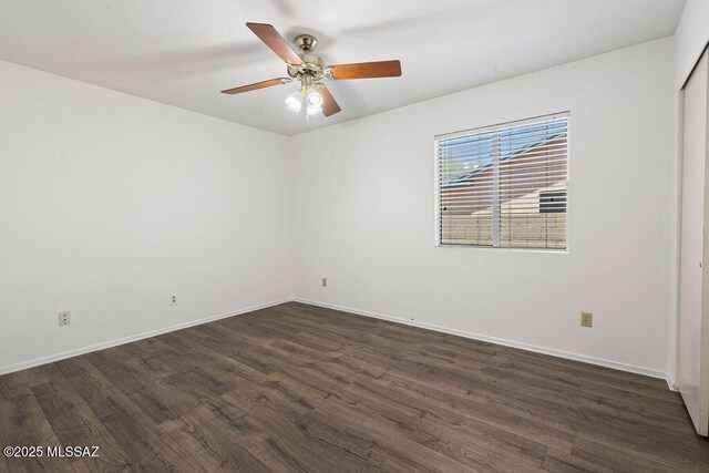7925 S Danforth Ave, Tucson, AZ 85747 - spare room with dark wood-style floors, baseboards, and a ceiling fan