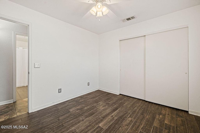 7925 S Danforth Ave, Tucson, AZ 85747 - unfurnished bedroom featuring wood finished floors, a closet, and baseboards