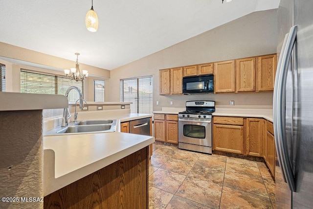 7925 S Danforth Ave, Tucson, AZ 85747 - kitchen with appliances with stainless steel finishes, vaulted ceiling, a sink, a chandelier, and hanging light fixtures