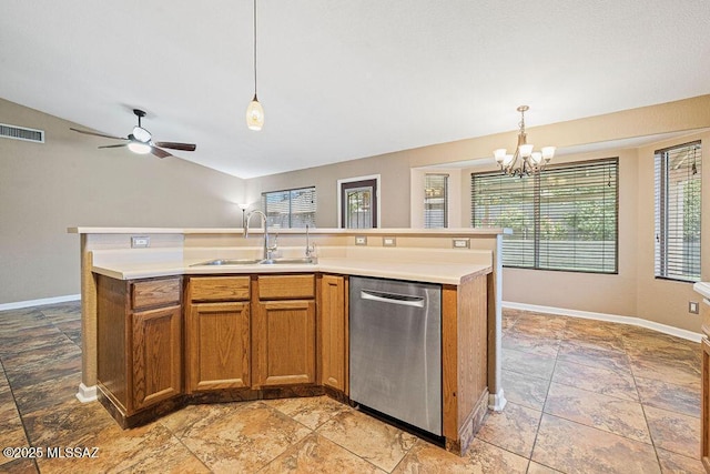 7925 S Danforth Ave, Tucson, AZ 85747 - kitchen with stainless steel dishwasher, a sink, brown cabinets, vaulted ceiling, and light countertops