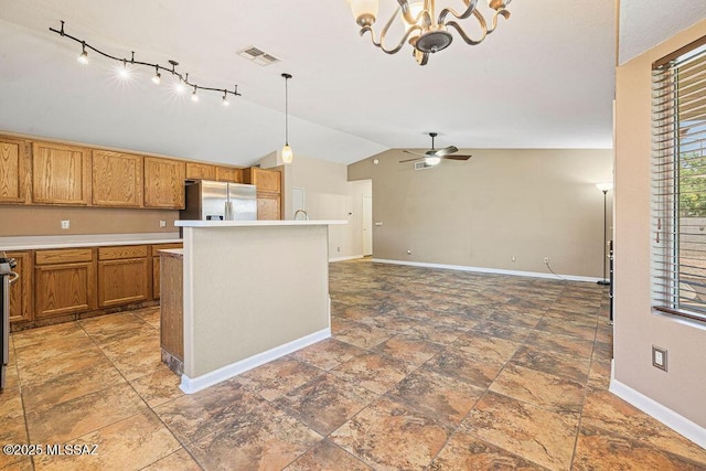 7925 S Danforth Ave, Tucson, AZ 85747 - kitchen featuring stainless steel refrigerator with ice dispenser, lofted ceiling, baseboards, brown cabinetry, and light countertops
