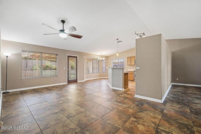 7925 S Danforth Ave, Tucson, AZ 85747 - unfurnished living room with a chandelier, a ceiling fan, baseboards, and vaulted ceiling