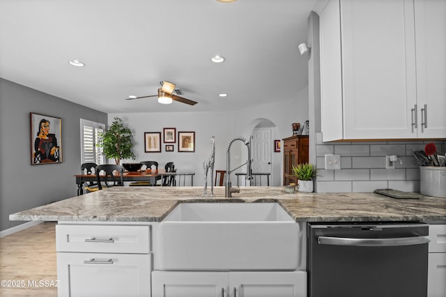 9000 N Twain St, Tucson, AZ 85742 - kitchen with dishwashing machine, a sink, decorative backsplash, light stone counters, and recessed lighting