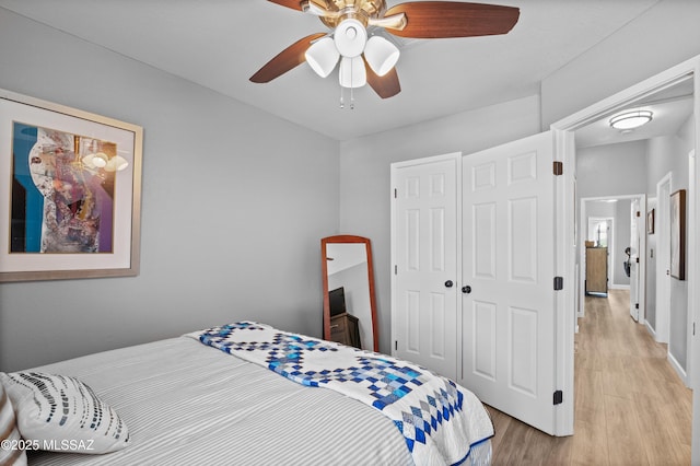 9000 N Twain St, Tucson, AZ 85742 - bedroom with a closet, light wood finished floors, ceiling fan, and baseboards