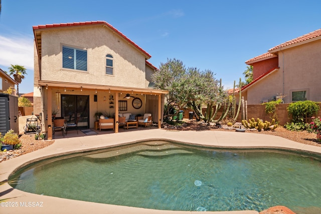 9000 N Twain St, Tucson, AZ 85742 - view of swimming pool with outdoor lounge area, a ceiling fan, a fenced backyard, and a patio area