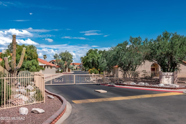 9000 N Twain St, Tucson, AZ 85742 - view of asphalt street featuring a gate, a gated entry, and curbs