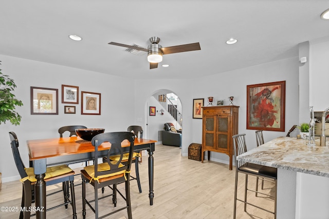 9000 N Twain St, Tucson, AZ 85742 - dining room featuring arched walkways, ceiling fan, recessed lighting, light wood-style floors, and baseboards