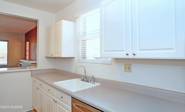 2422 E Drachman St, Tucson, AZ 85719 - kitchen with a sink, healthy amount of natural light, and white cabinetry