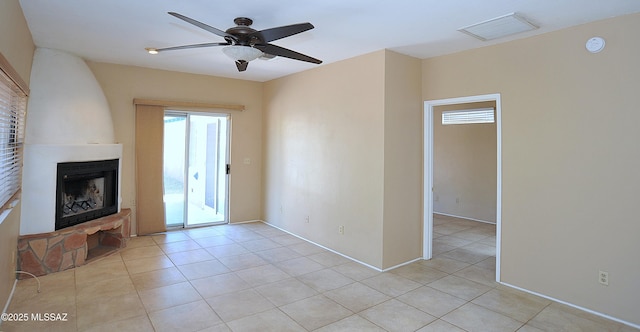 2422 E Drachman St, Tucson, AZ 85719 - unfurnished living room with ceiling fan, light tile patterned flooring, and a large fireplace