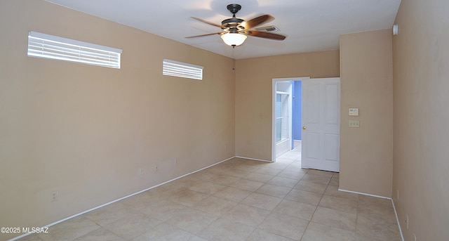 2422 E Drachman St, Tucson, AZ 85719 - unfurnished room featuring a ceiling fan, baseboards, and light tile patterned floors