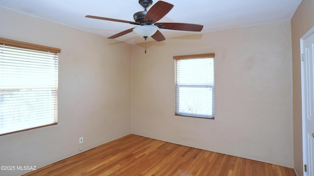 2422 E Drachman St, Tucson, AZ 85719 - empty room with a ceiling fan and light wood-style floors