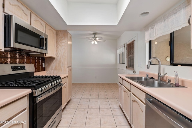 242 E Calle Turquesa, Tucson, AZ 85704 - kitchen with stainless steel appliances, a sink, light brown cabinets, light countertops, and ceiling fan