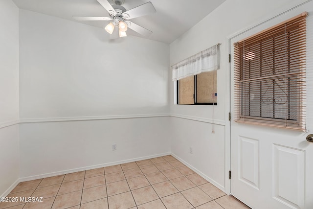 242 E Calle Turquesa, Tucson, AZ 85704 - empty room featuring light tile patterned floors, ceiling fan, and baseboards
