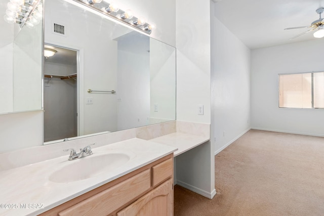 242 E Calle Turquesa, Tucson, AZ 85704 - bathroom with ceiling fan, vanity, and baseboards