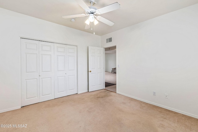 242 E Calle Turquesa, Tucson, AZ 85704 - unfurnished bedroom with carpet flooring, baseboards, a closet, and a ceiling fan