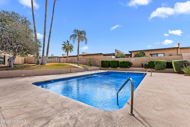 242 E Calle Turquesa, Tucson, AZ 85704 - community pool featuring a fenced backyard and a patio