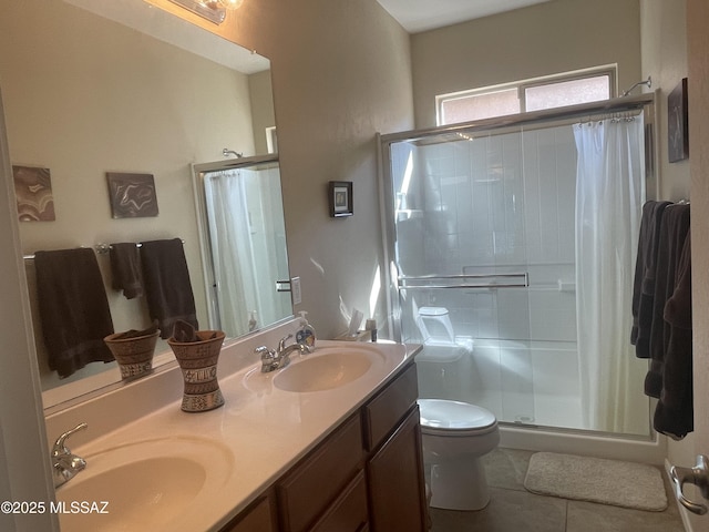 15808 S Via Cayetano, Sahuarita, AZ 85629 - bathroom featuring a shower stall, tile patterned flooring, double vanity, and toilet