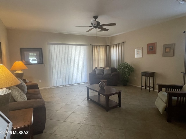 15808 S Via Cayetano, Sahuarita, AZ 85629 - living room featuring a ceiling fan, tile patterned flooring, and baseboards