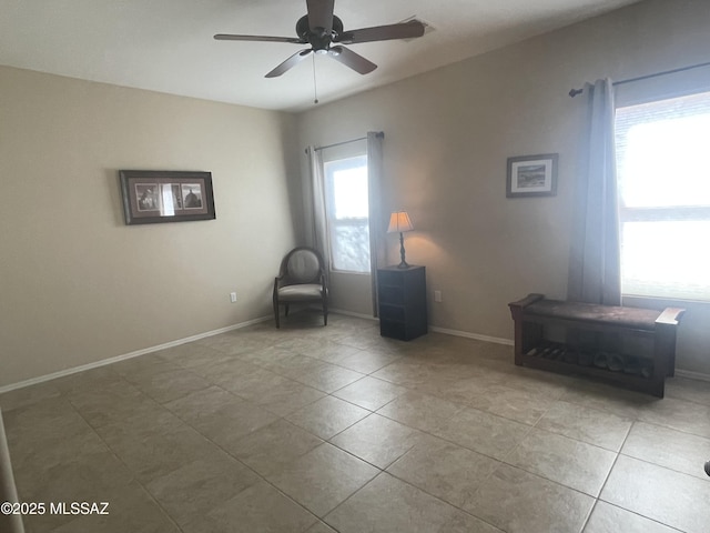 15808 S Via Cayetano, Sahuarita, AZ 85629 - living area with ceiling fan, tile patterned floors, and baseboards