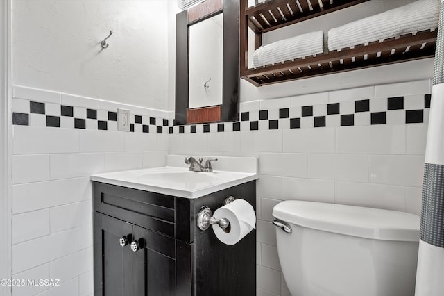 966 N Richey Blvd, Tucson, AZ 85716 - bathroom featuring tile walls, toilet, and vanity