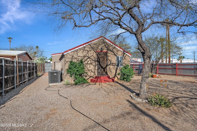 966 N Richey Blvd, Tucson, AZ 85716 - rear view of house featuring cooling unit and stucco siding