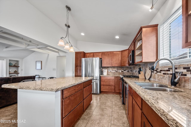 966 N Richey Blvd, Tucson, AZ 85716 - kitchen with appliances with stainless steel finishes, lofted ceiling, a sink, decorative backsplash, and a center island