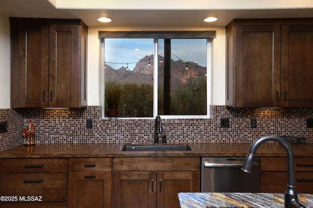 10550 N Lambert Pl, Tucson, AZ 85737 - kitchen with a sink, decorative backsplash, a mountain view, and dark stone counters