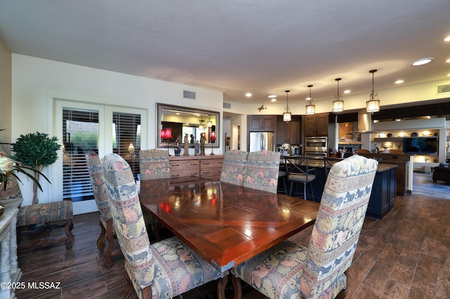 10550 N Lambert Pl, Tucson, AZ 85737 - dining space featuring dark wood-type flooring and recessed lighting