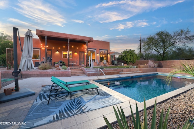 10550 N Lambert Pl, Tucson, AZ 85737 - pool at dusk with a patio