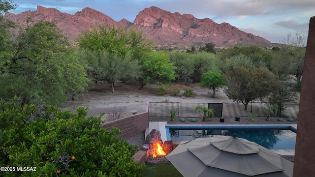 10550 N Lambert Pl, Tucson, AZ 85737 - view of swimming pool with a fire pit and a mountain view