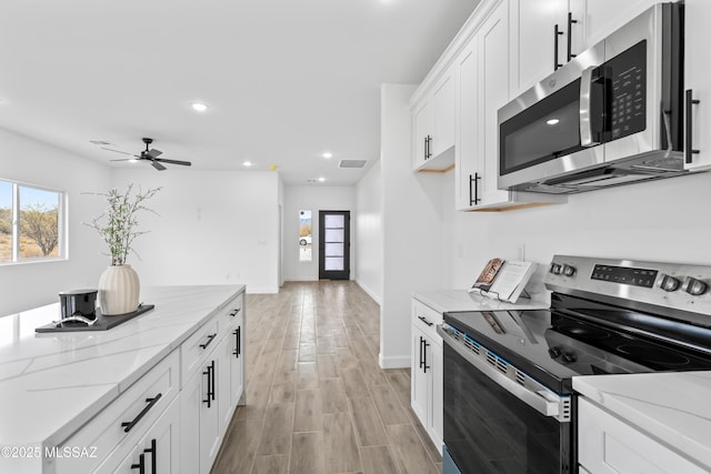 1917 Circulo Mexicali, Rio Rico, AZ 85648 - kitchen with appliances with stainless steel finishes, healthy amount of natural light, a ceiling fan, baseboards, and recessed lighting