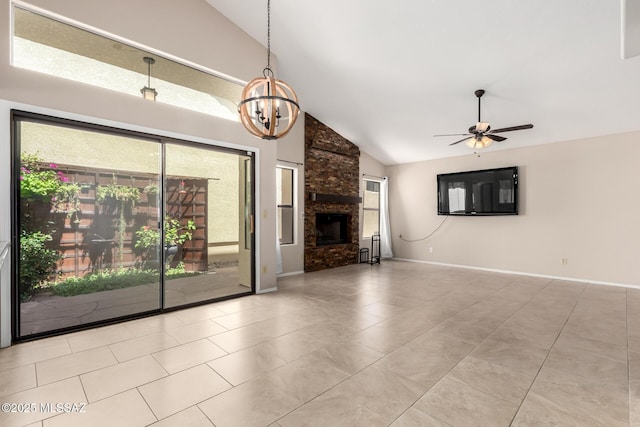 231 E Highcourte Ln, Tucson, AZ 85737 - unfurnished living room with a ceiling fan, a chandelier, tile patterned floors, a stone fireplace, and high vaulted ceiling