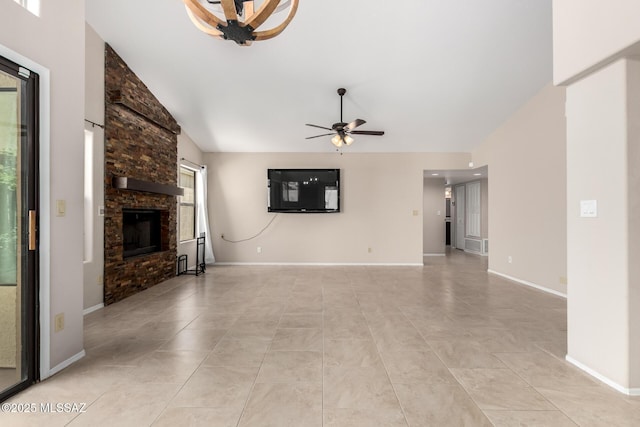 231 E Highcourte Ln, Tucson, AZ 85737 - unfurnished living room with a ceiling fan, a stone fireplace, light tile patterned floors, vaulted ceiling, and baseboards