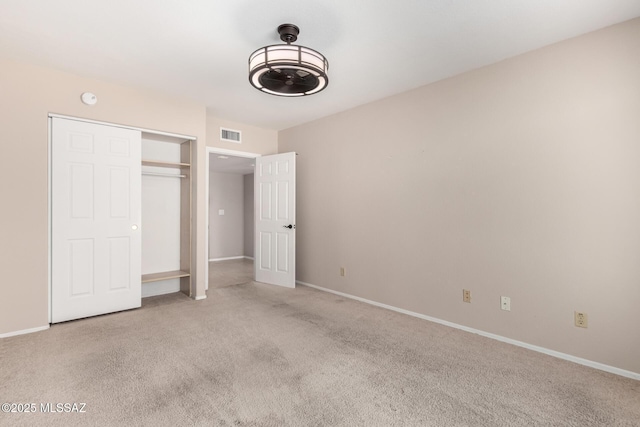 231 E Highcourte Ln, Tucson, AZ 85737 - unfurnished bedroom with carpet floors, a closet, and baseboards