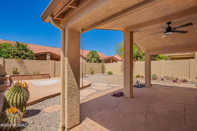231 E Highcourte Ln, Tucson, AZ 85737 - fenced backyard with a patio area and a ceiling fan