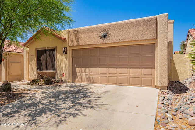 231 E Highcourte Ln, Tucson, AZ 85737 - adobe home featuring stucco siding, a garage, and driveway