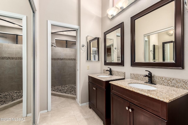 231 E Highcourte Ln, Tucson, AZ 85737 - full bath with a shower stall, two vanities, and baseboards