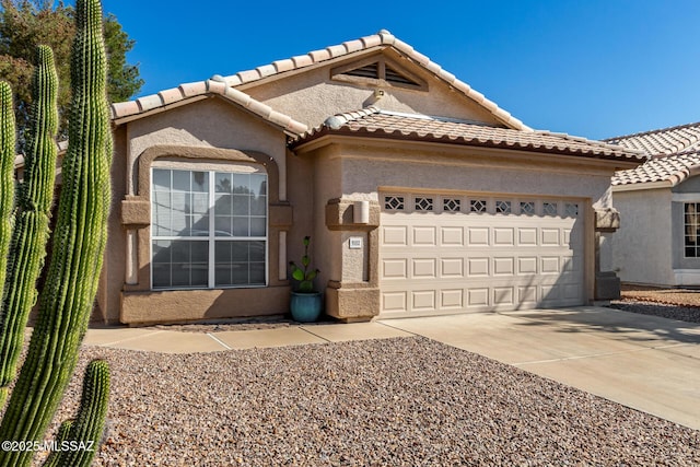 9102 N Safflower Ln, Tucson, AZ 85743 - view of front of house featuring a garage, stucco siding, concrete driveway, and a tile roof