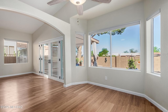 9102 N Safflower Ln, Tucson, AZ 85743 - empty room with wood finished floors, baseboards, and healthy amount of natural light