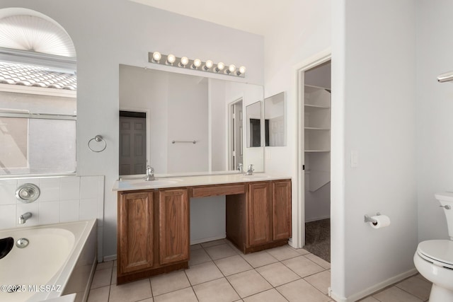9102 N Safflower Ln, Tucson, AZ 85743 - full bathroom featuring tile patterned floors, a bath, toilet, and double vanity