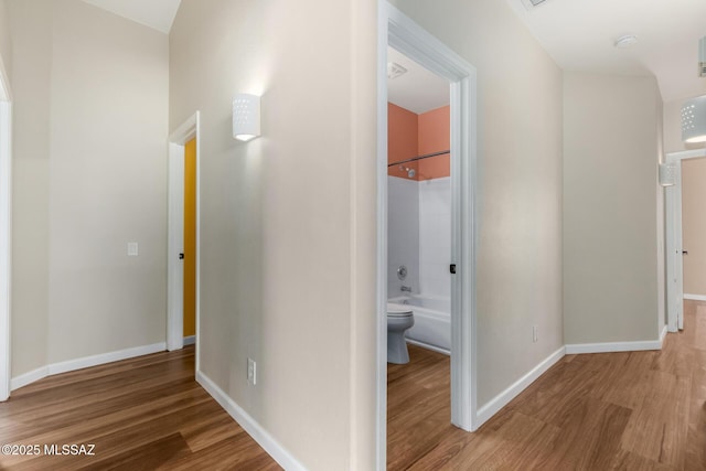 9102 N Safflower Ln, Tucson, AZ 85743 - hall featuring wood finished floors and baseboards