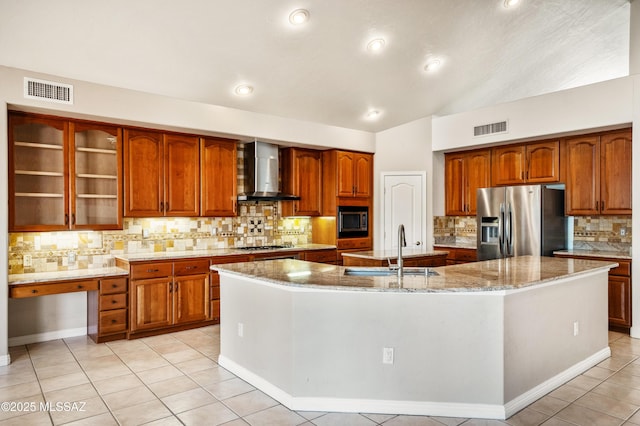 11562 N Scioto Ave, Tucson, AZ 85737 - kitchen with appliances with stainless steel finishes, wall chimney range hood, a sink, a spacious island, and tasteful backsplash