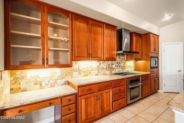 11562 N Scioto Ave, Tucson, AZ 85737 - kitchen featuring wall chimney exhaust hood, stainless steel appliances, light stone countertops, light tile patterned floors, and brown cabinets