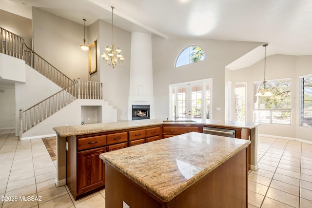 11562 N Scioto Ave, Tucson, AZ 85737 - kitchen with a center island, a sink, light tile patterned flooring, high vaulted ceiling, and a chandelier